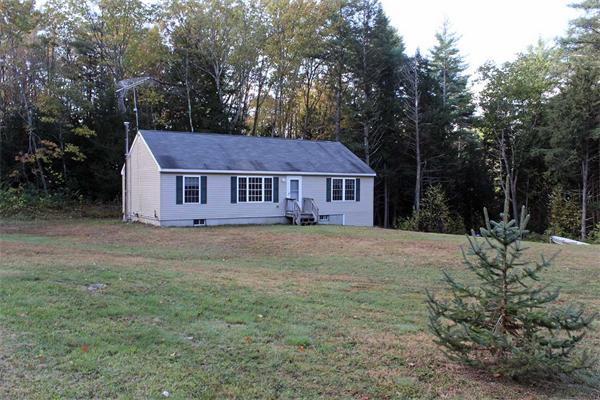 808 Orange Road Warwick, MA 01378 - Photo 6 of 30 a front view of a house with garden