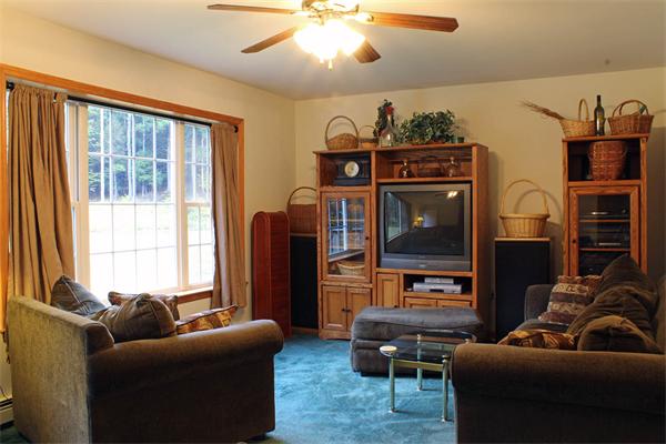 808 Orange Road Warwick, MA 01378 - Photo 8 of 30 a living room with furniture and a flat screen tv