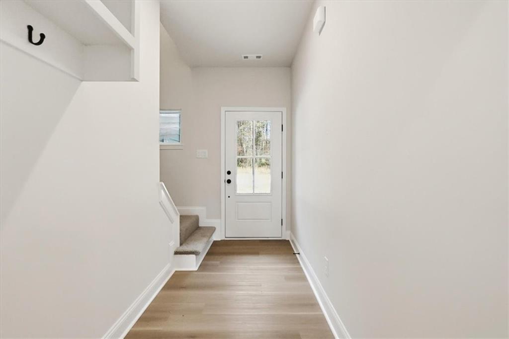 49 Wright Street, Unit 65 Lavonia, GA 30553 - Photo 3 of 17 a view of a hallway with wooden floor