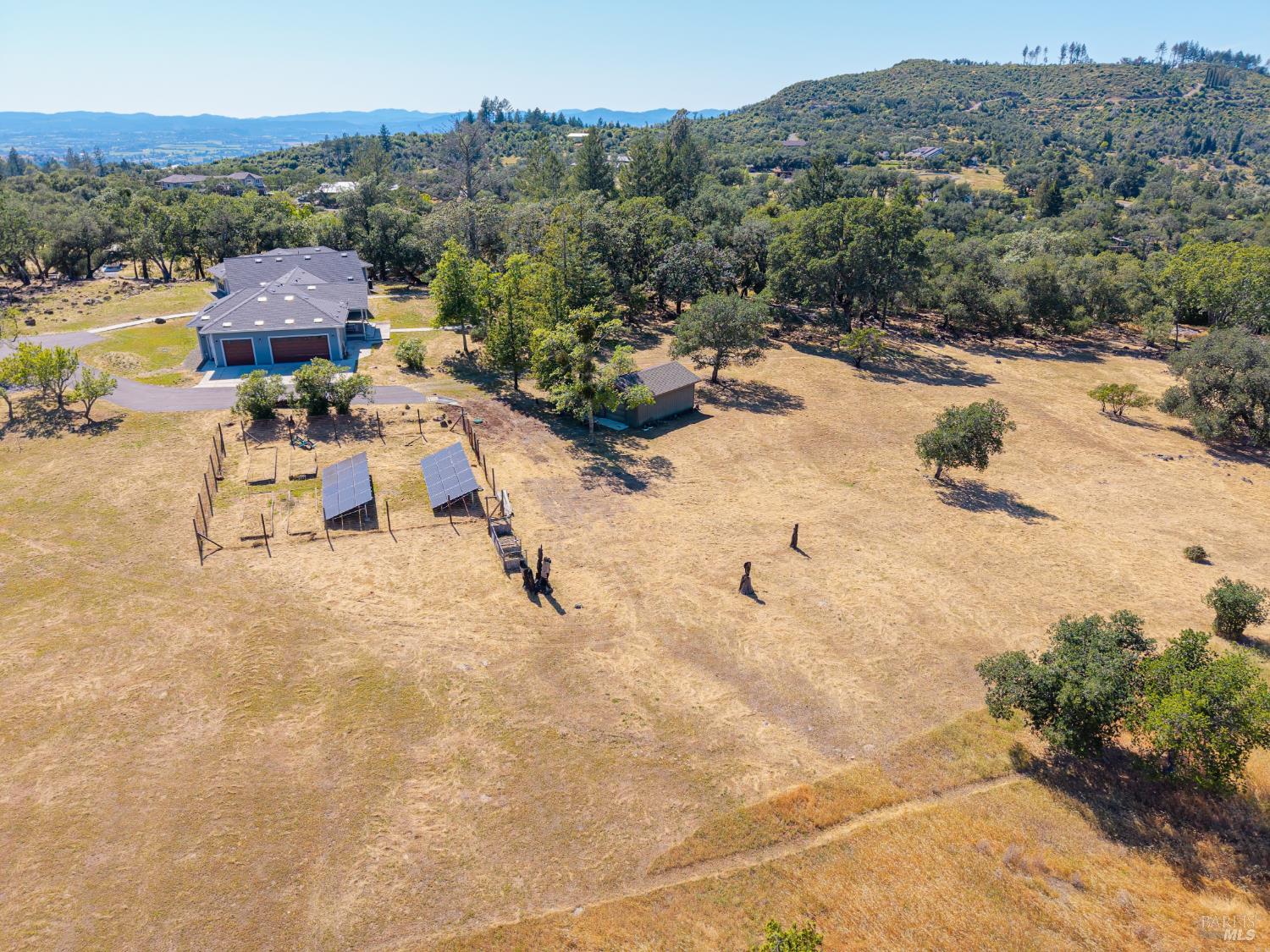 4665 Upper Ridge Road Santa Rosa, CA 95404 - Photo 68 of 71 an aerial view of a swimming pool with a mountain view
