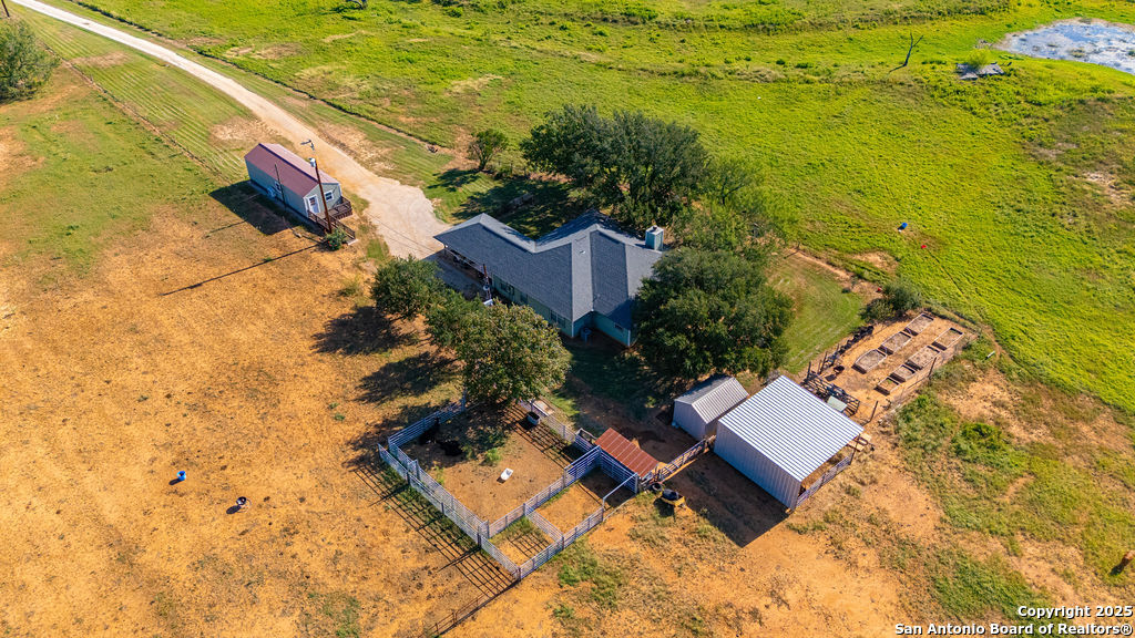 16020 Farm To Market Road 463 Lytle, TX 78052 - Photo 11 of 39 an aerial view of residential house with pool and ocean view
