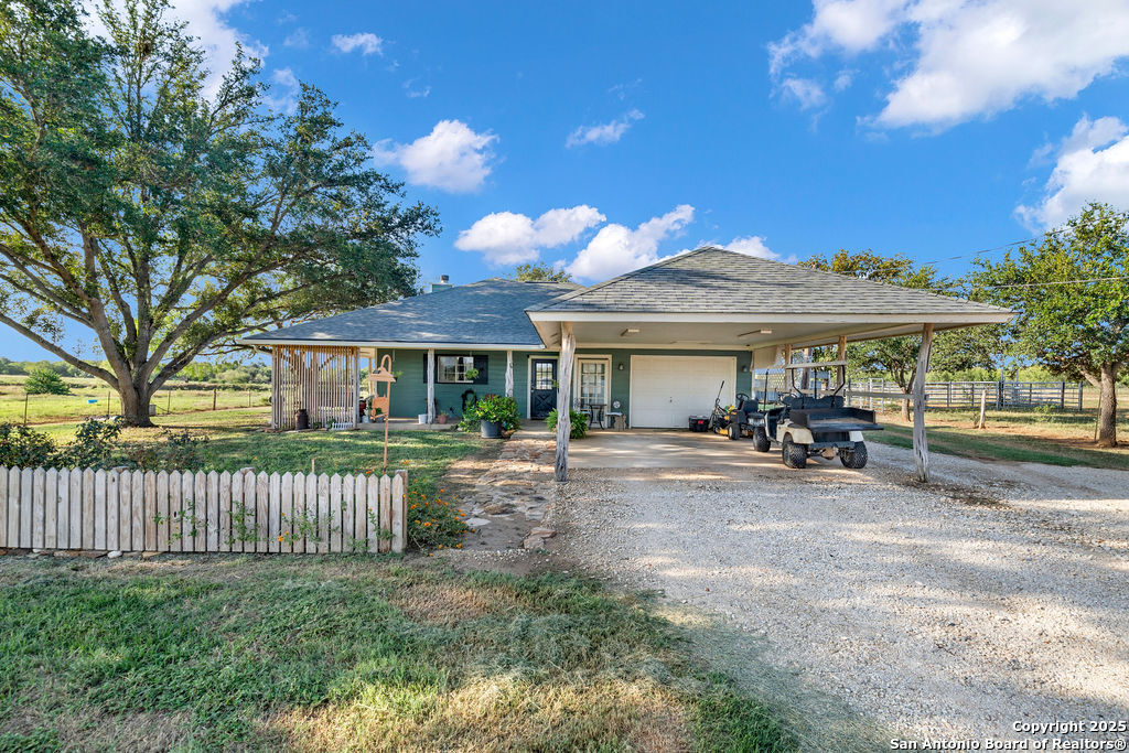 16020 Farm To Market Road 463 Lytle, TX 78052 - Photo 2 of 39 a view of a house with a yard and sitting area
