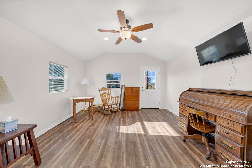 16020 Farm To Market Road 463 Lytle, TX 78052 - Photo 30 of 39 a living room with furniture and a flat screen tv