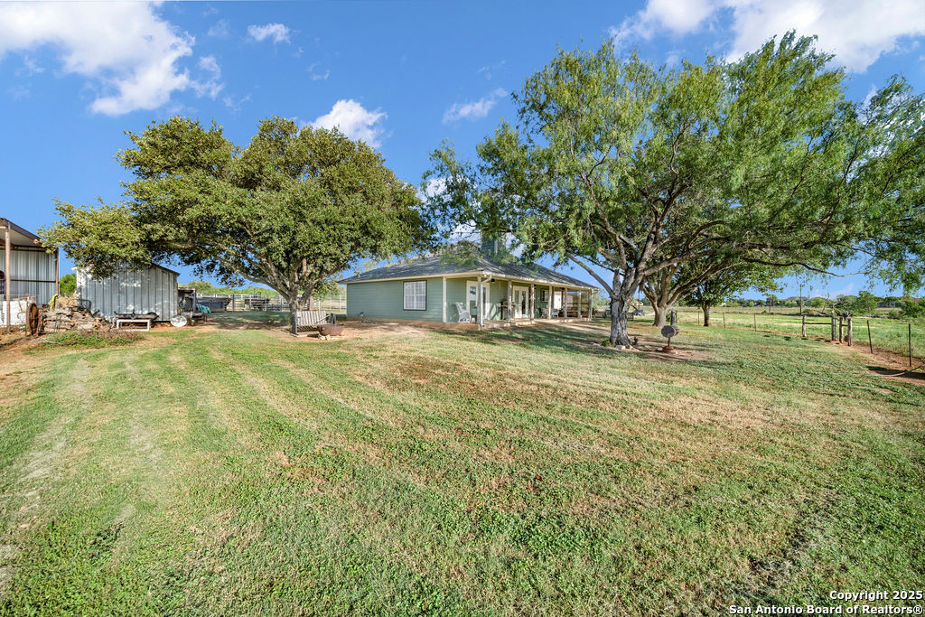 16020 Farm To Market Road 463 Lytle, TX 78052 - Photo 3 of 39 a front view of a house with a yard
