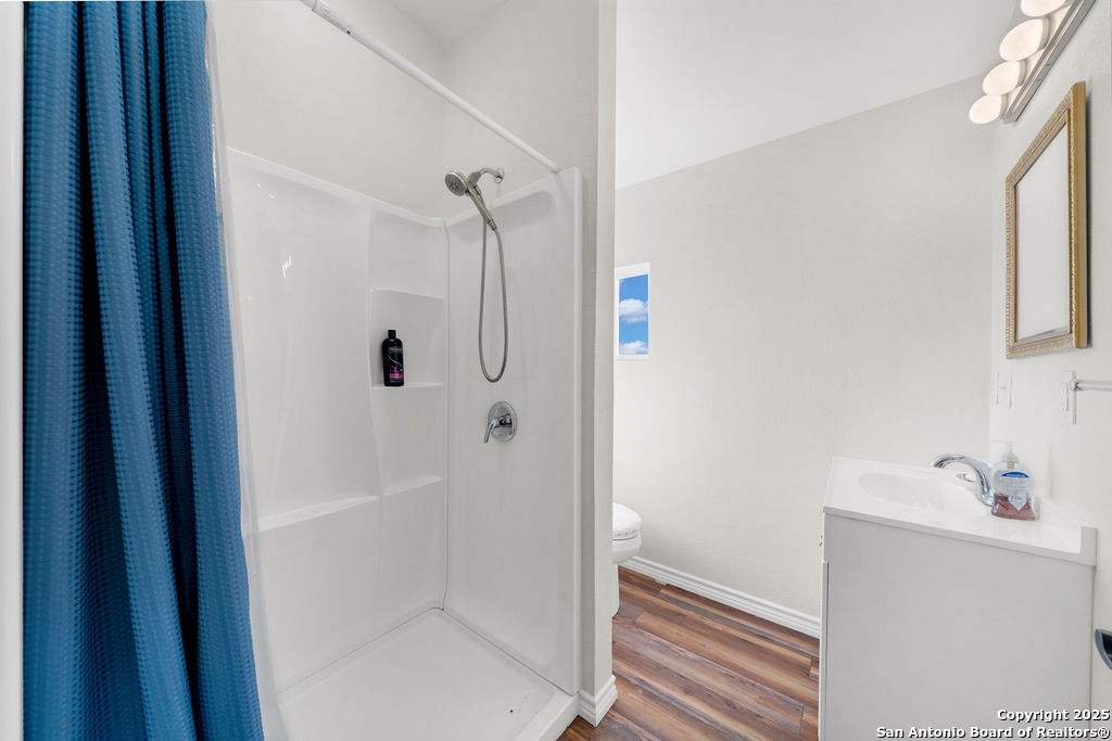 16020 Farm To Market Road 463 Lytle, TX 78052 - Photo 35 of 39 a bathroom with a bathtub and a shower