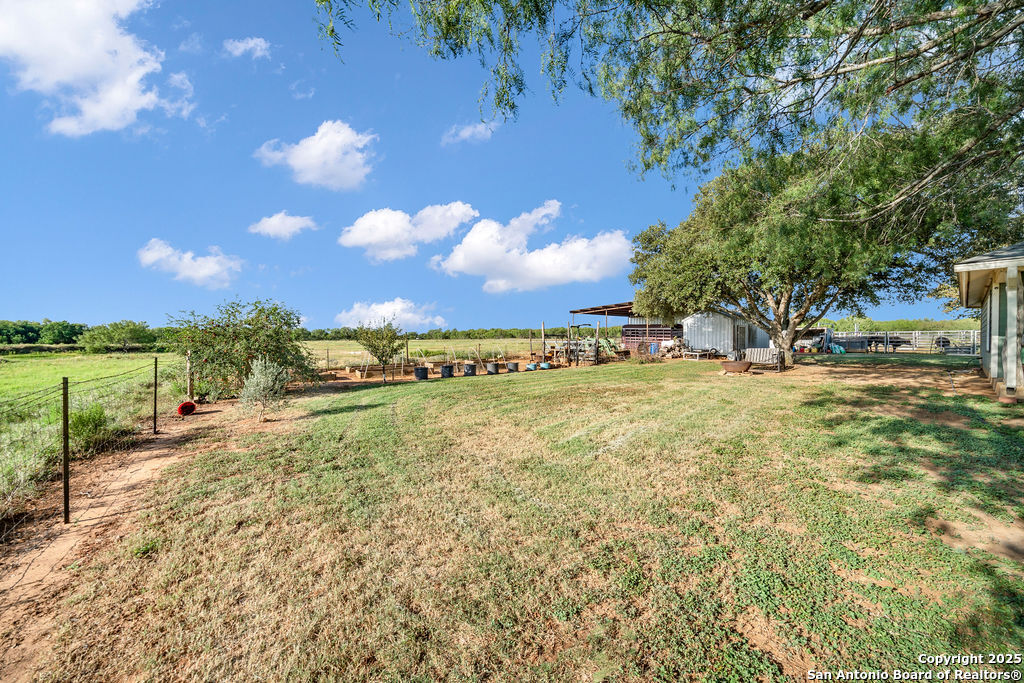 16020 Farm To Market Road 463 Lytle, TX 78052 - Photo 37 of 39 a view of an outdoor space and a yard