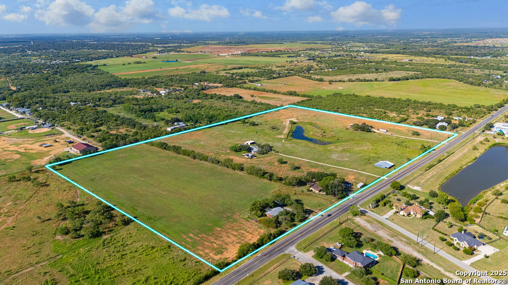 16020 Farm To Market Road 463 Lytle, TX 78052 - Photo 7 of 39 a view of a tennis court