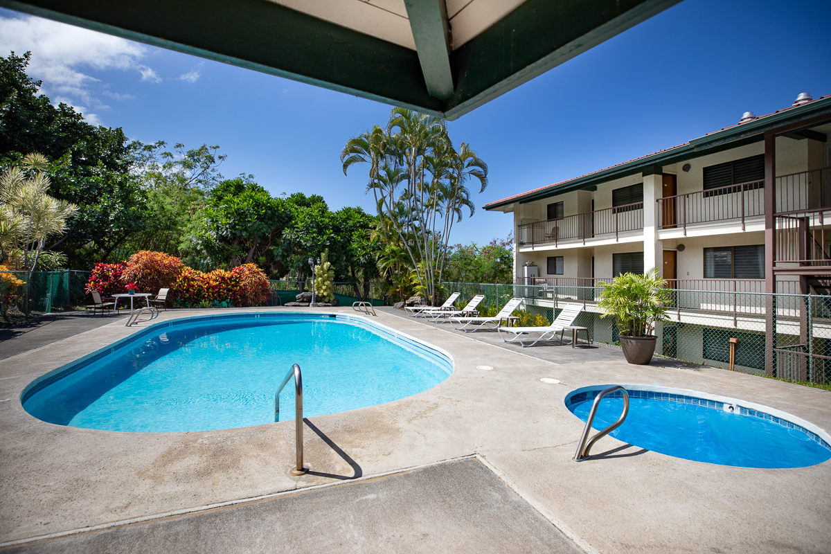 77-6585 Sea View Circle, Unit 104 Kailua-Kona, HI 96740 - Photo 7 of 23 an outdoor space with swimming pool and furniture