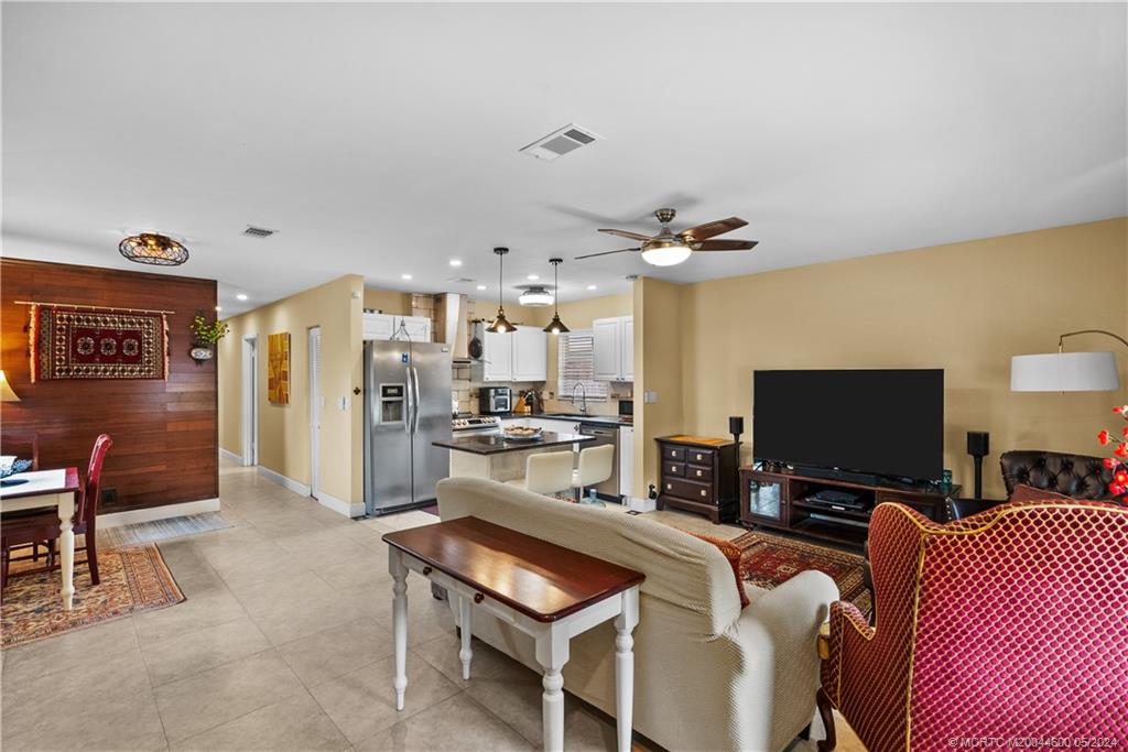 301 Lancaster Street Boca Raton, FL 33487 - Photo 5 of 20 a living room with furniture and a flat screen tv