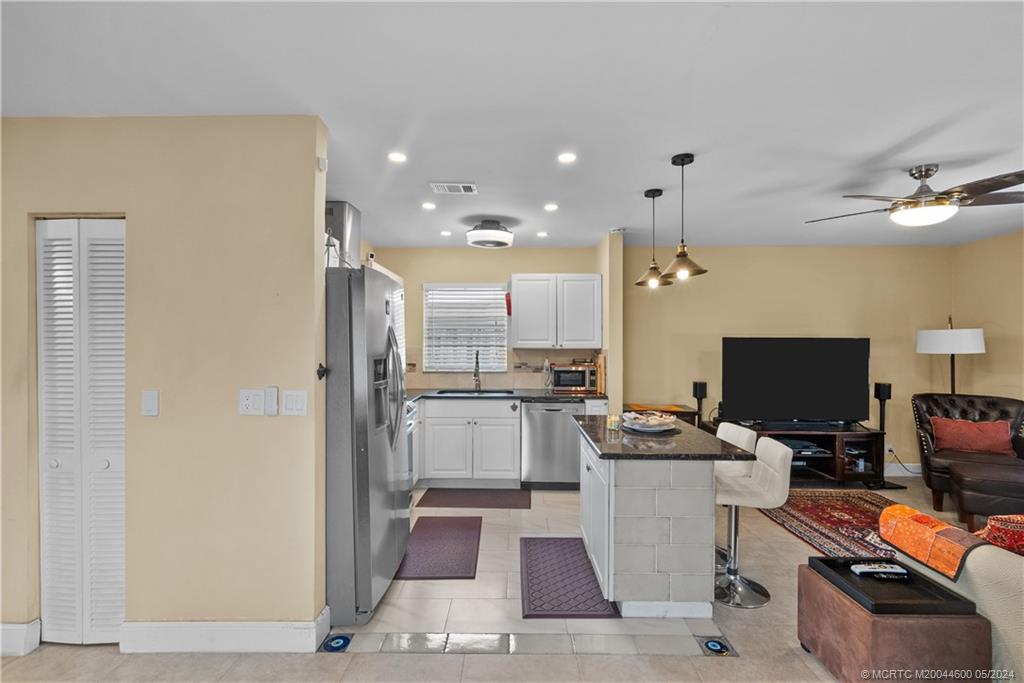 301 Lancaster Street Boca Raton, FL 33487 - Photo 8 of 20 a kitchen with a sink appliances and cabinets