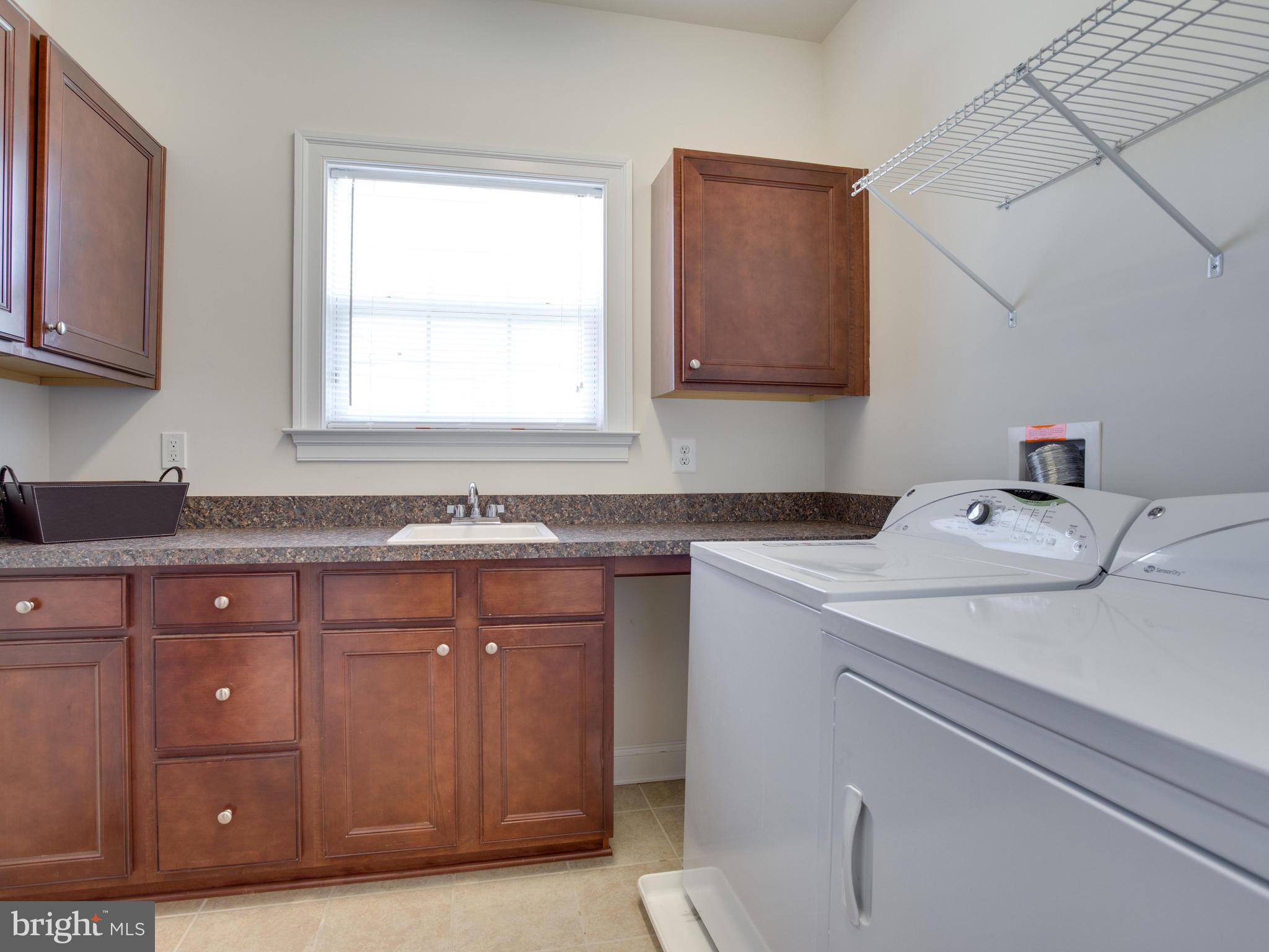 13001 Contee Manor Road Bowie, MD 20721 - Photo 18 of 43 Main Level Laundry Room with Sink and Folding Area