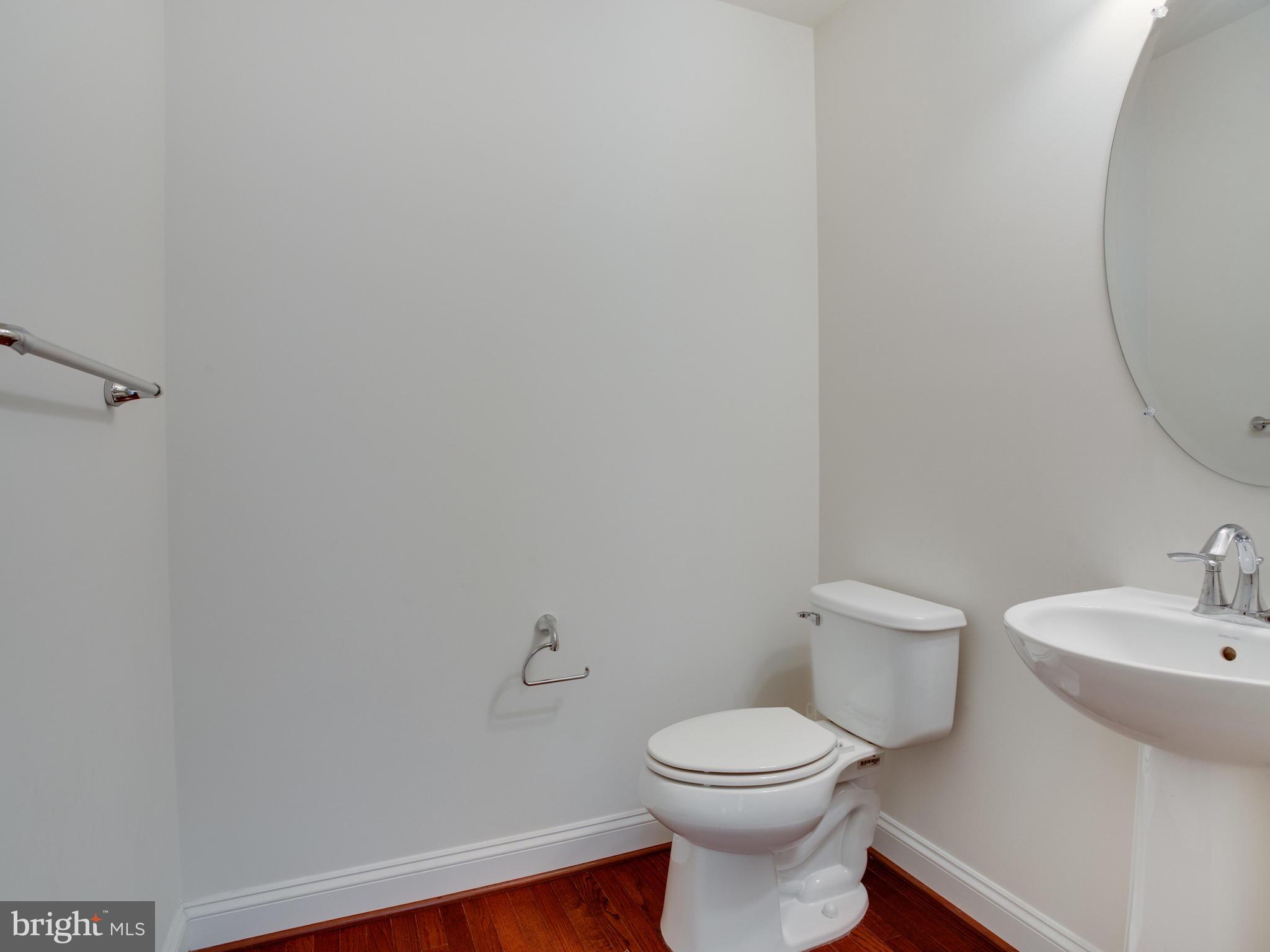 13001 Contee Manor Road Bowie, MD 20721 - Photo 20 of 43 Half Bath on Main Level Displays Rich Hardwoods