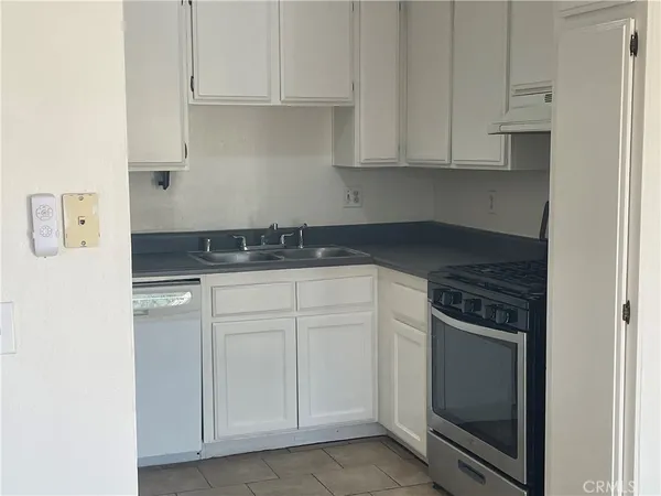 a view of an empty room with glass door