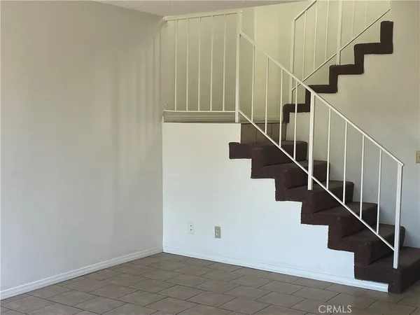 a view of empty room with floor to ceiling window