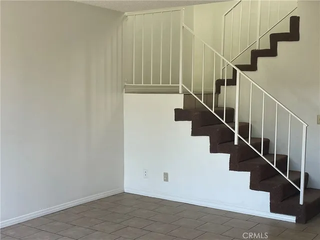 a view of empty room with floor to ceiling window