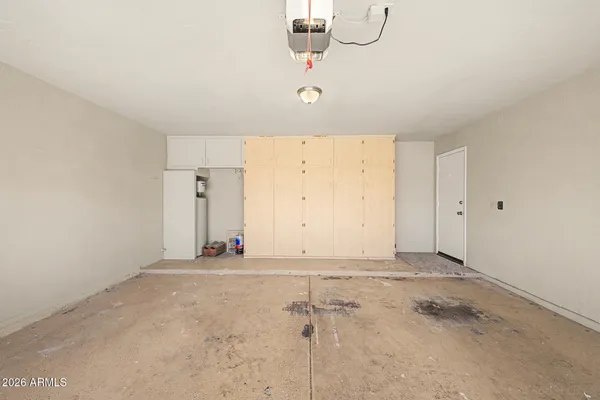 a view of a storage & utility room with a sink