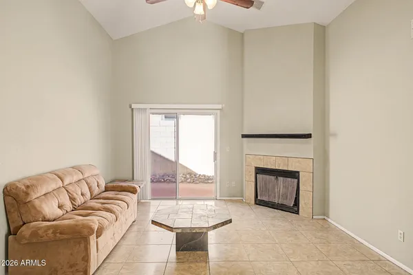 a living room with furniture and a fireplace