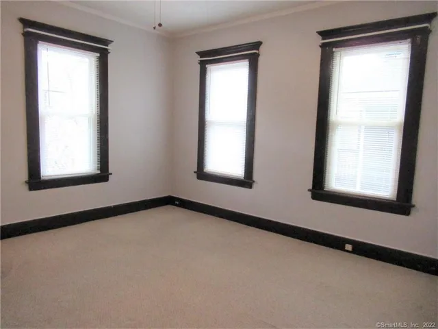 a view of an empty room and window