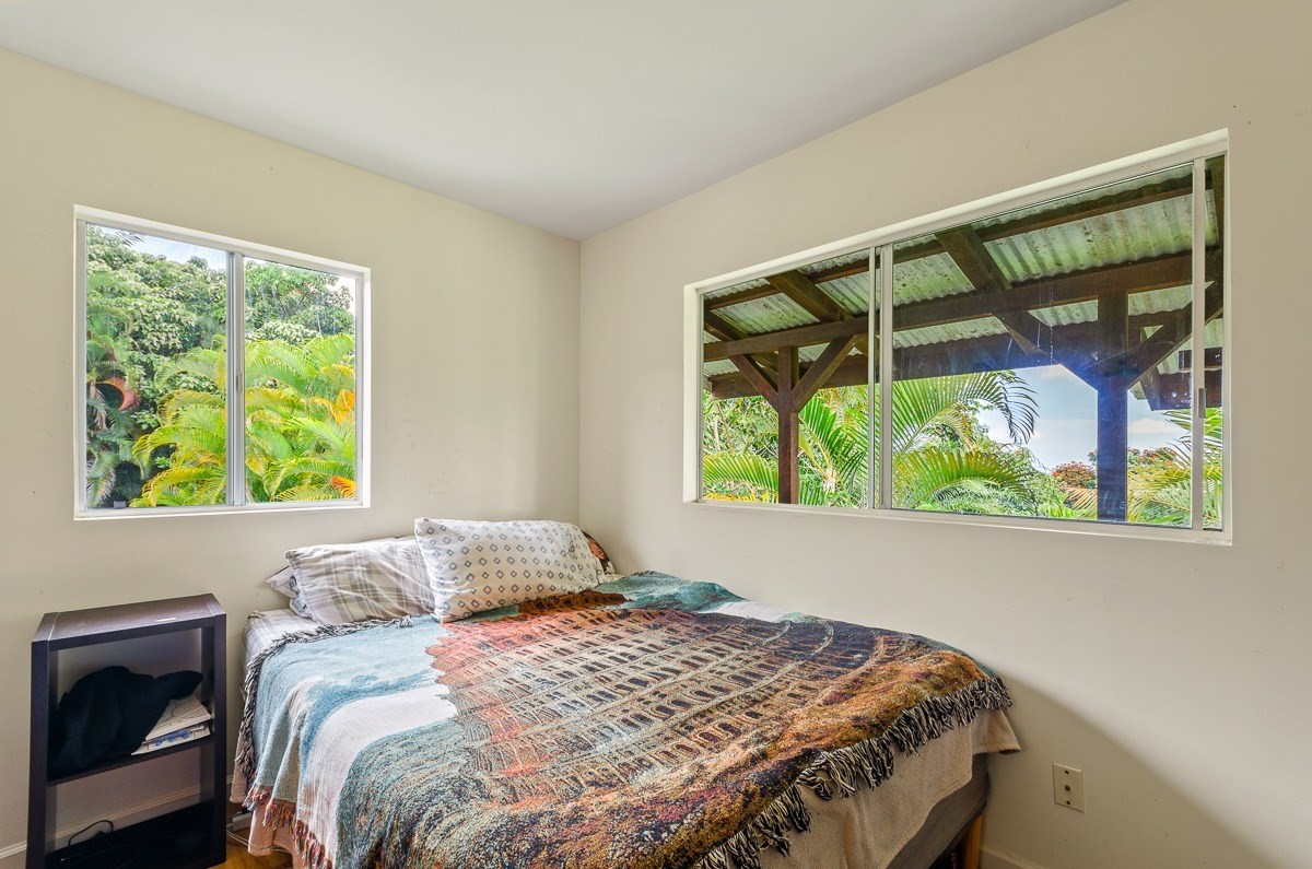 83-5434-C Middle Keei Road Captain Cook, HI 96704 - Photo 12 of 30 a bedroom with a bed and a window