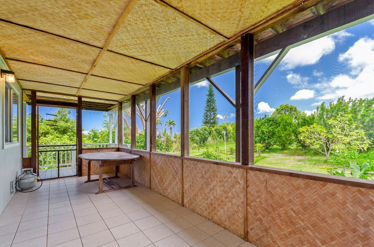 83-5434-C Middle Keei Road Captain Cook, HI 96704 - Photo 18 of 30 a view of a porch with furniture and a backyard
