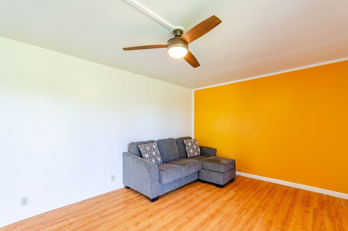 83-5434-C Middle Keei Road Captain Cook, HI 96704 - Photo 21 of 30 a living room with couch and a wooden floor