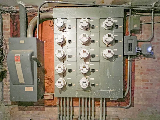 a bathroom with a granite countertop shower and a sink