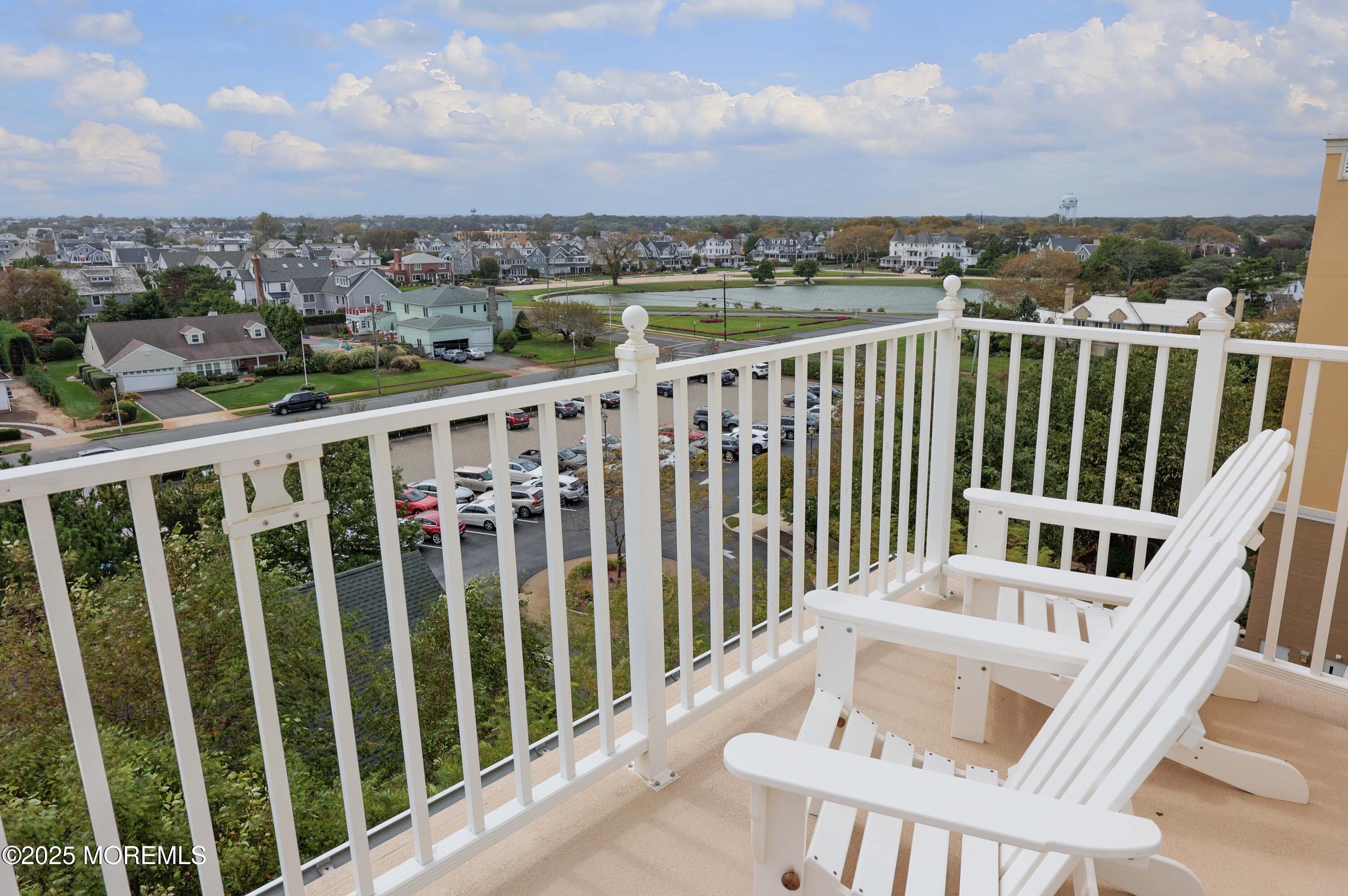 700 Ocean Avenue, Unit 531 Spring Lake, NJ 07762 - Photo 11 of 42 a view of a balcony with wooden fence