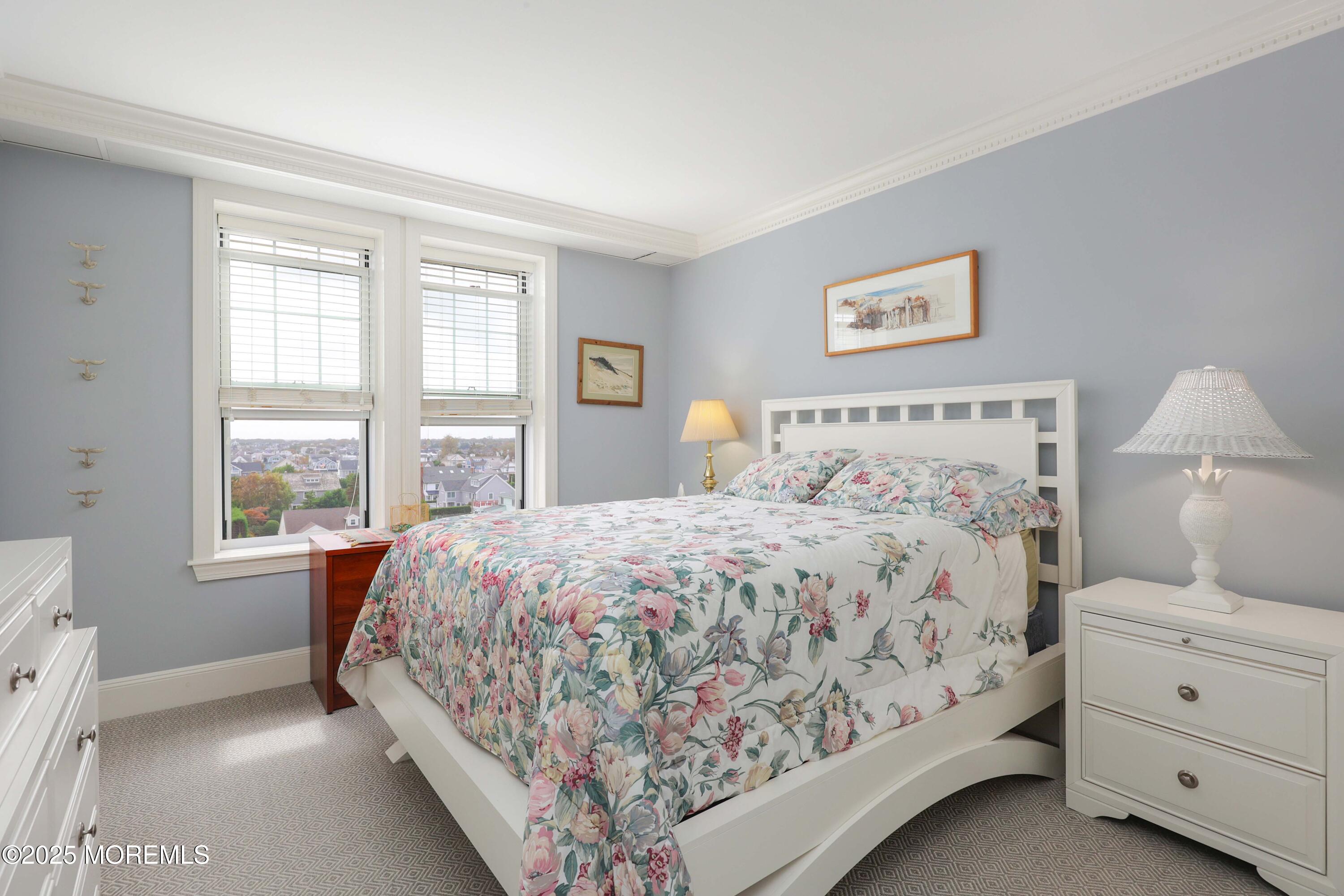 700 Ocean Avenue, Unit 531 Spring Lake, NJ 07762 - Photo 12 of 42 a bedroom with a large bed and a window