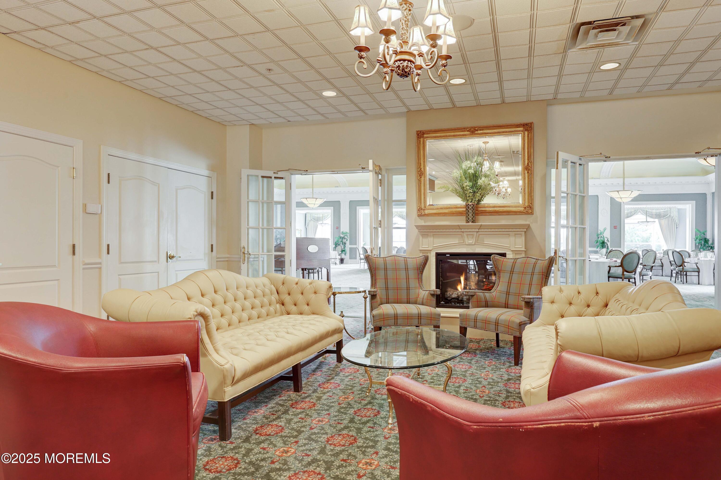 700 Ocean Avenue, Unit 531 Spring Lake, NJ 07762 - Photo 20 of 42 a living room with furniture and a fireplace