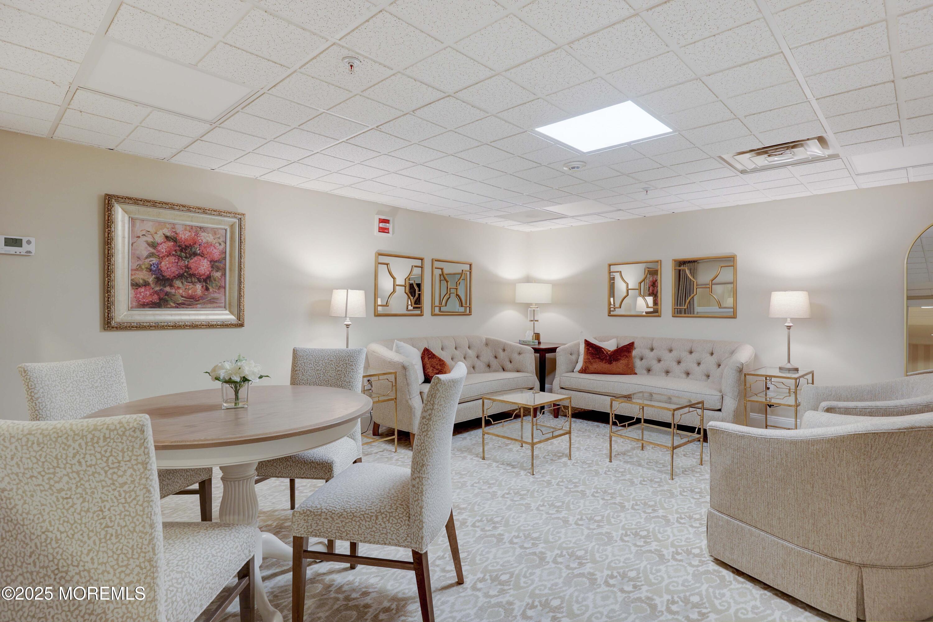 700 Ocean Avenue, Unit 531 Spring Lake, NJ 07762 - Photo 32 of 42 a living room with furniture and a table