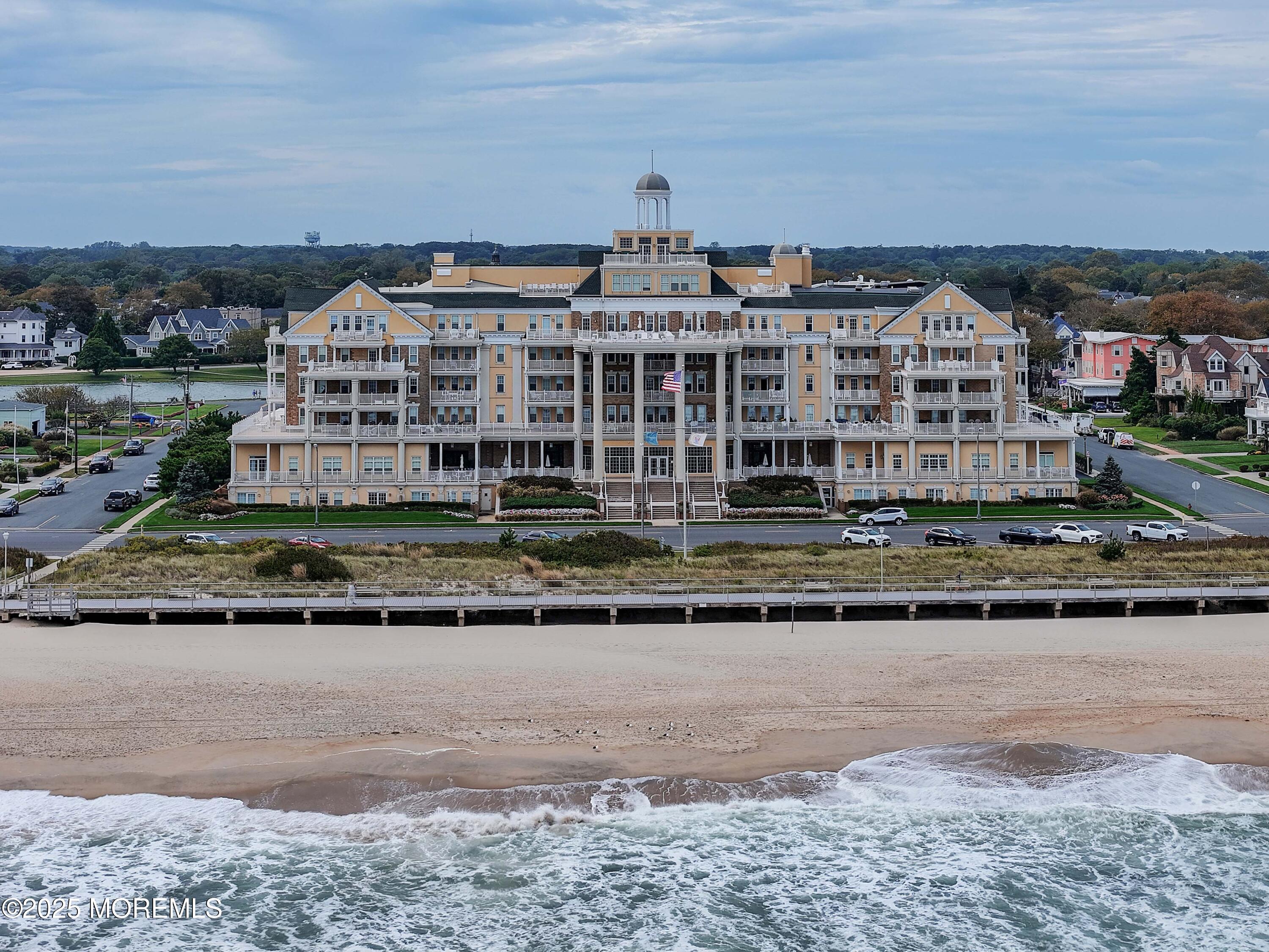 700 Ocean Avenue, Unit 531 Spring Lake, NJ 07762 - Photo 41 of 42 a view of a big building with a big yard and large trees