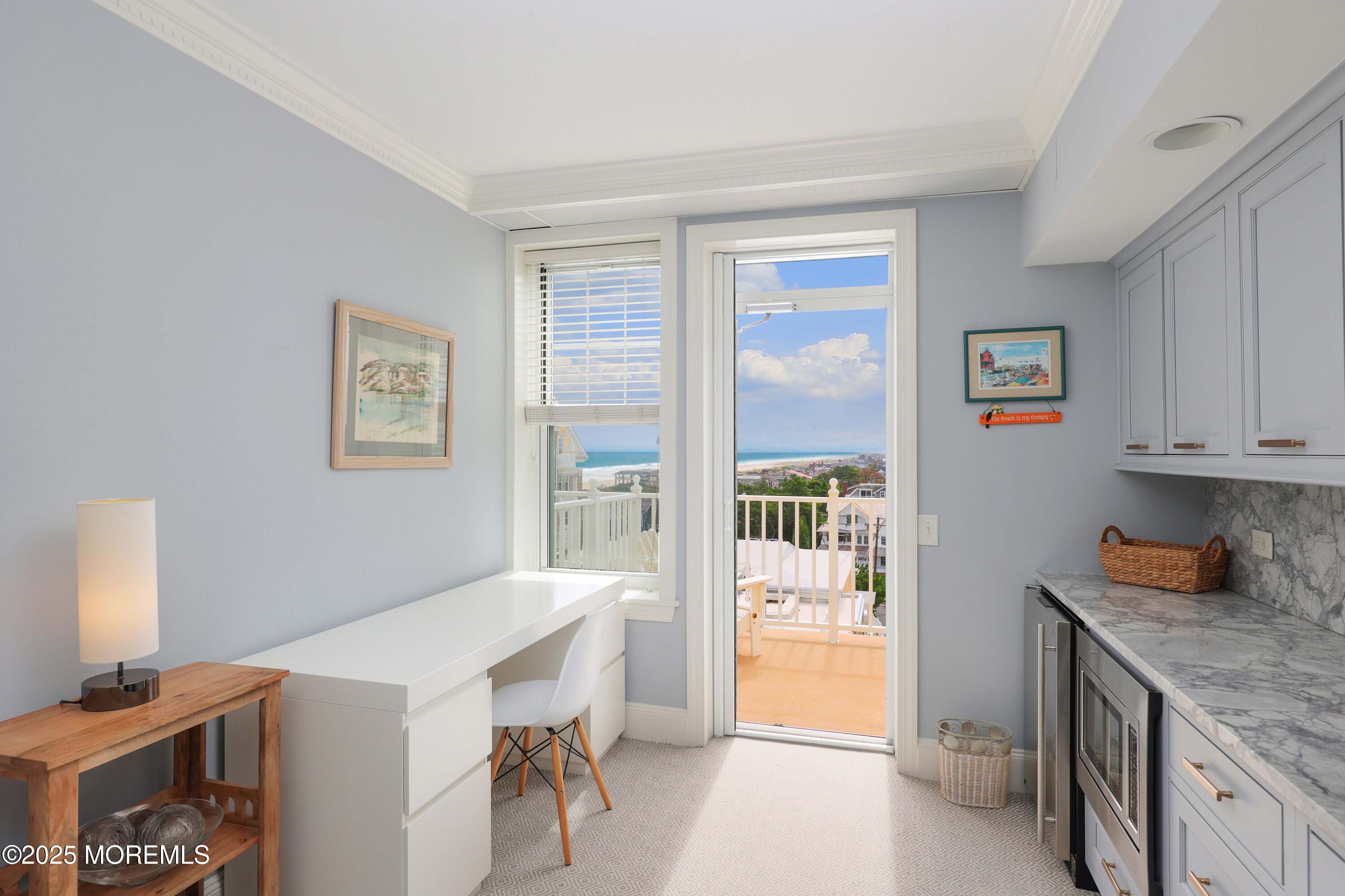 700 Ocean Avenue, Unit 531 Spring Lake, NJ 07762 - Photo 6 of 42 a kitchen with a refrigerator and a stove