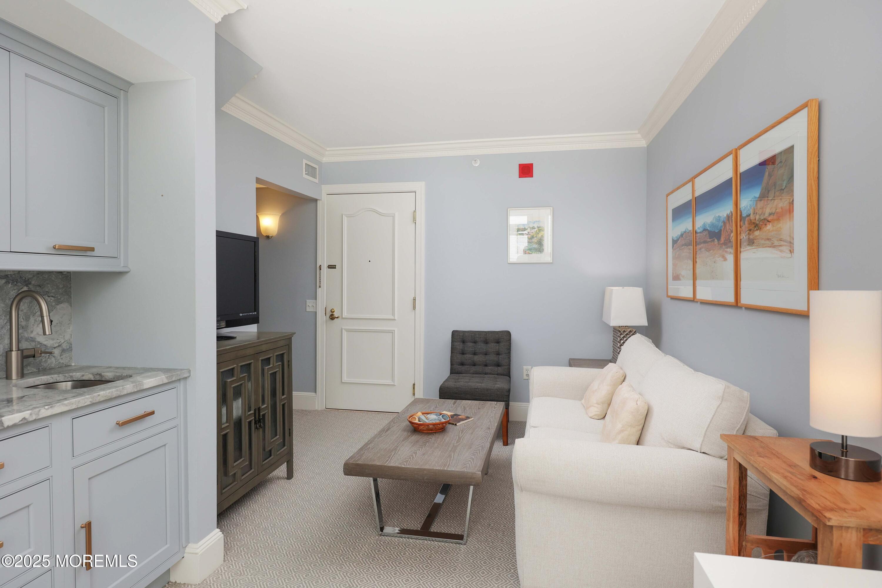 700 Ocean Avenue, Unit 531 Spring Lake, NJ 07762 - Photo 9 of 42 a living room with furniture and a window