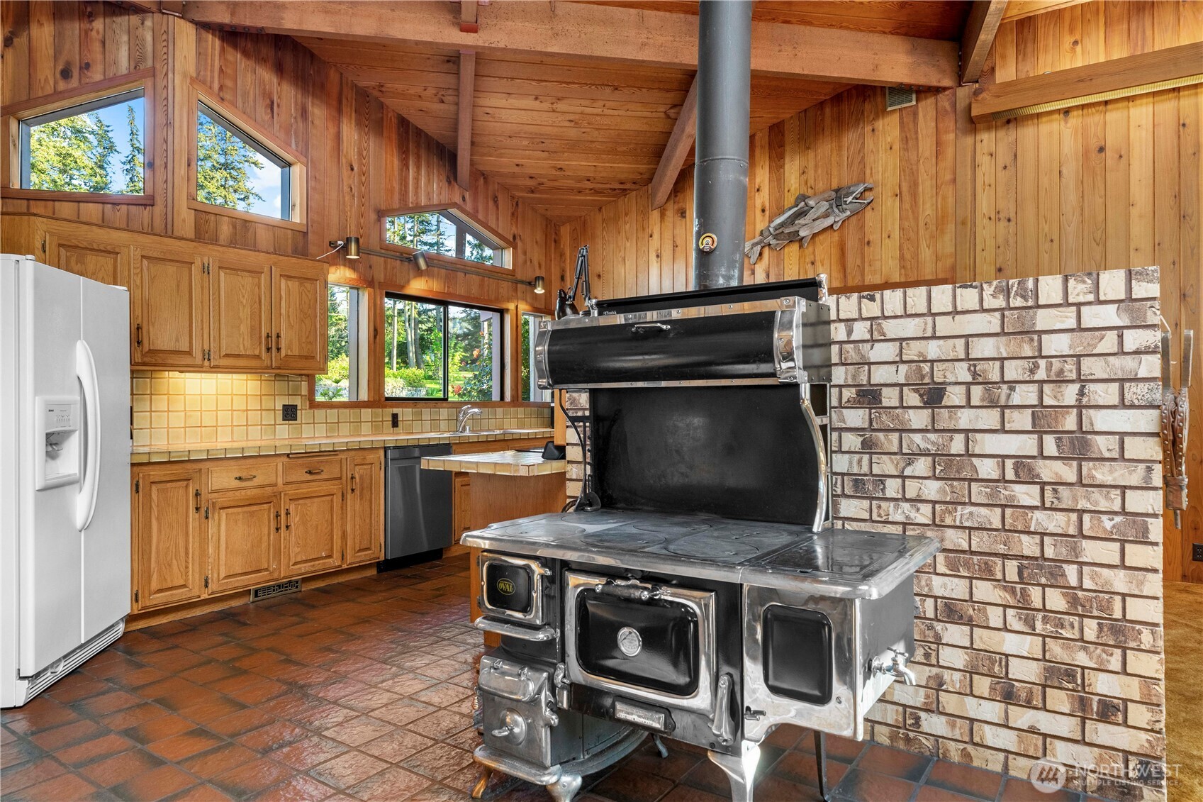 491 Bachelor Road Sequim, WA 98382 - Photo 13 of 39 a kitchen with a stove and a microwave