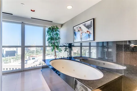 a bathroom with a bathtub and a sink