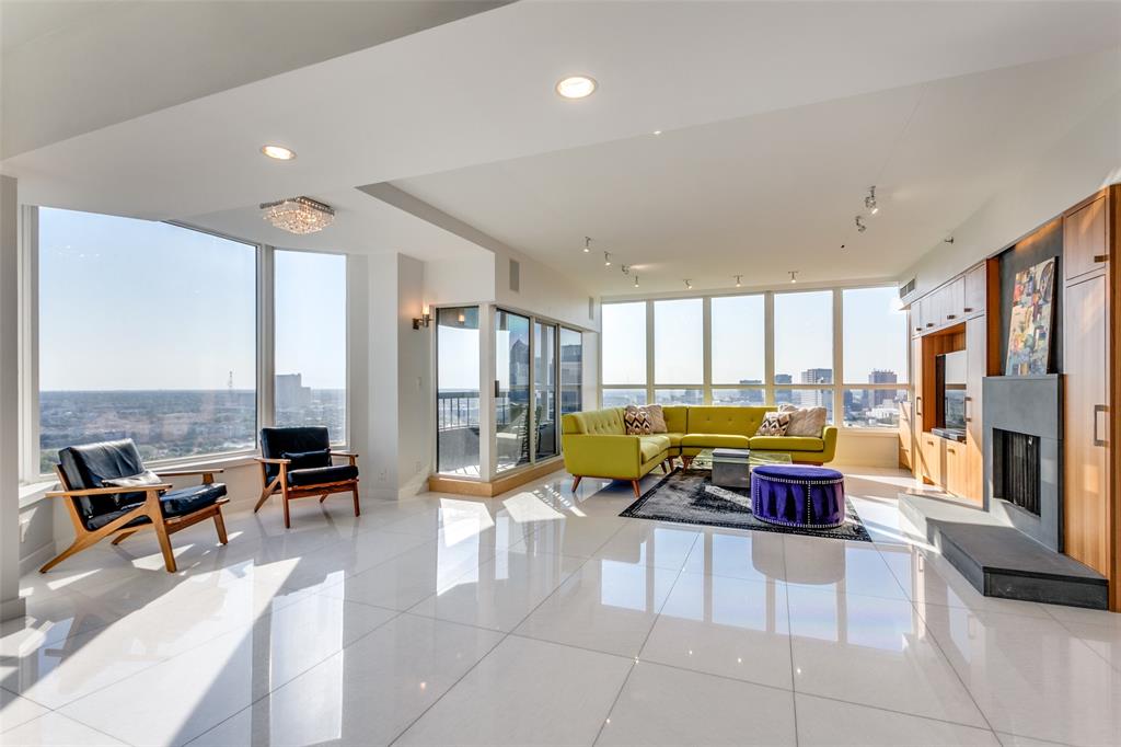 3030 McKinney Avenue, Unit 2301 Dallas, TX 75204 - Photo 6 of 34 a living room with furniture and floor to ceiling windows