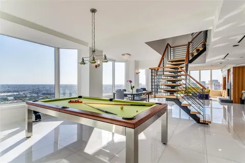 a room with lots of furniture and view of living room