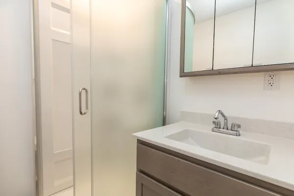 a bathroom with a sink and vanity