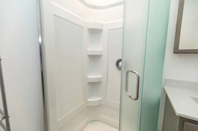 a bathroom with a shower and toilet