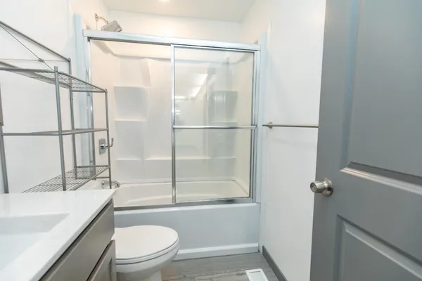 a bathroom with a sink and a shower