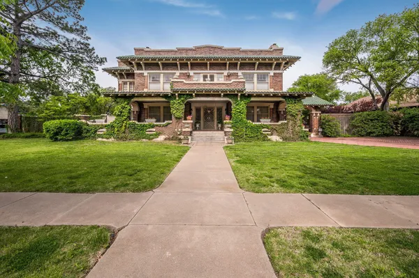 a front view of a building with garden