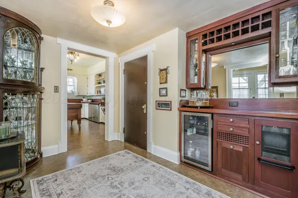 a kitchen with granite countertop a stove a sink and a microwave