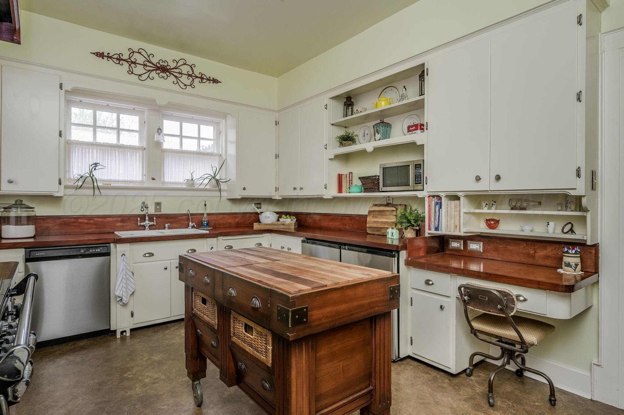 1620 South Tyler Street Amarillo, TX 79102 - Photo 17 of 66 a kitchen with a stove and a sink