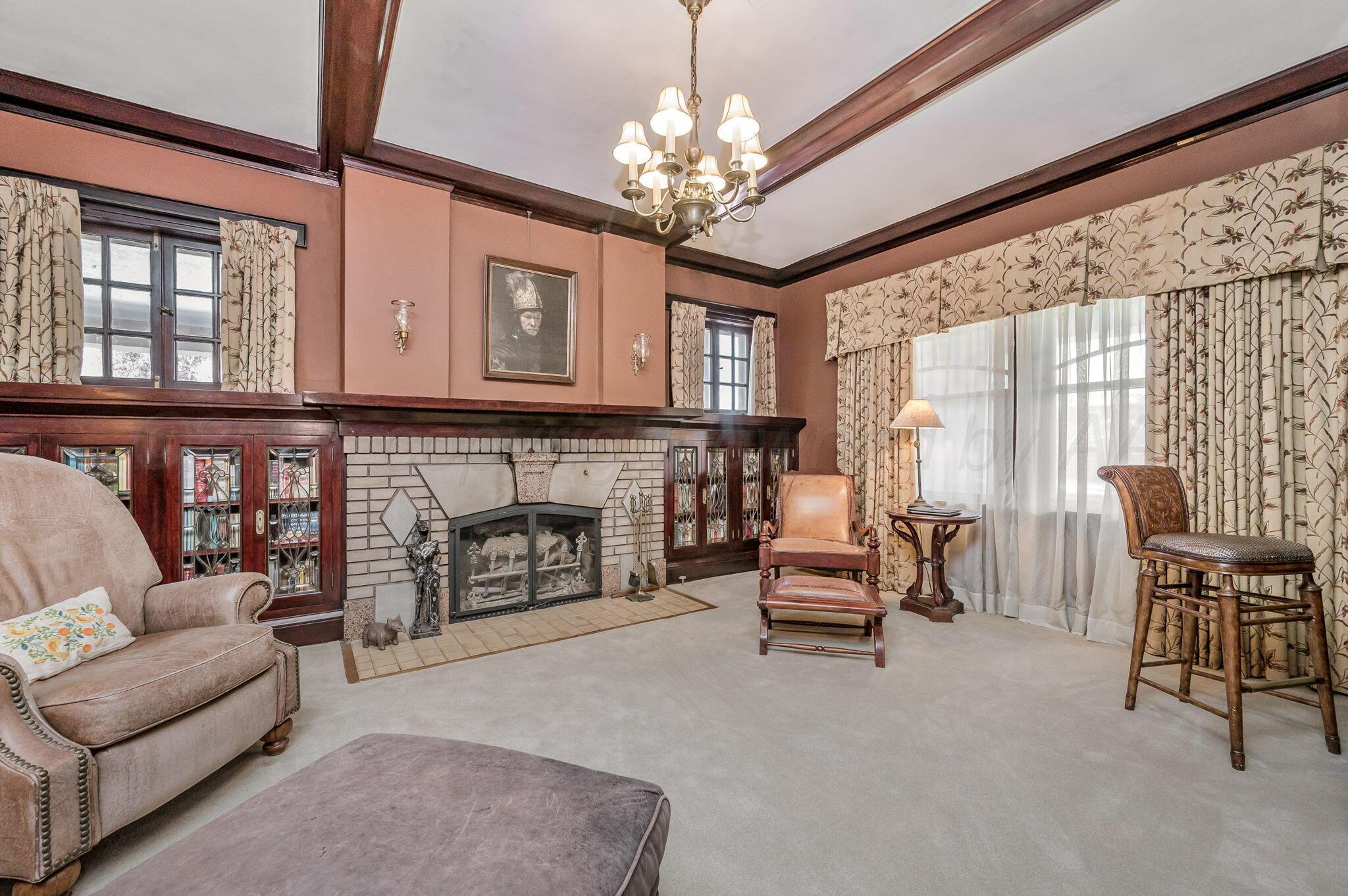 1620 South Tyler Street Amarillo, TX 79102 - Photo 25 of 66 a living room with furniture a fireplace and a chandelier