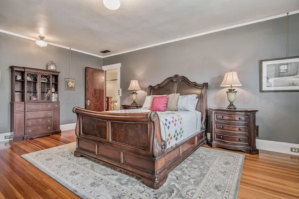 a bedroom with a bed and a table