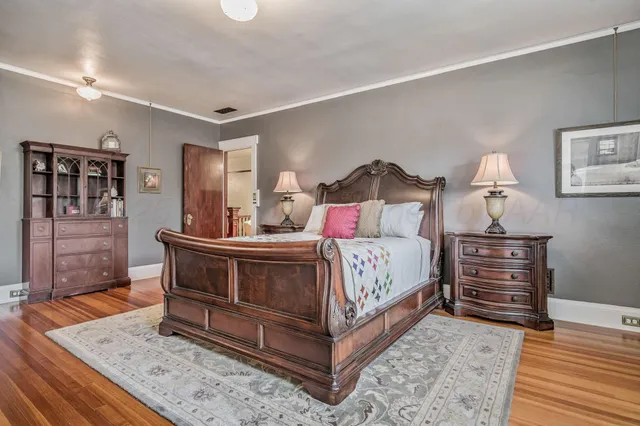 a bedroom with a bed and a table