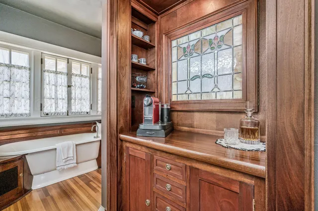 a bathroom with a bathtub and a window