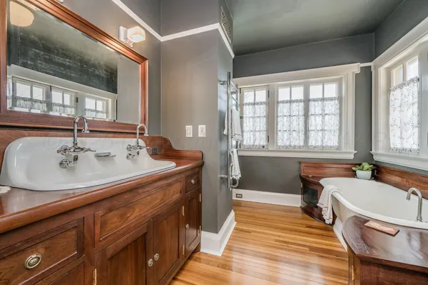 a living room with furniture a rug and a window
