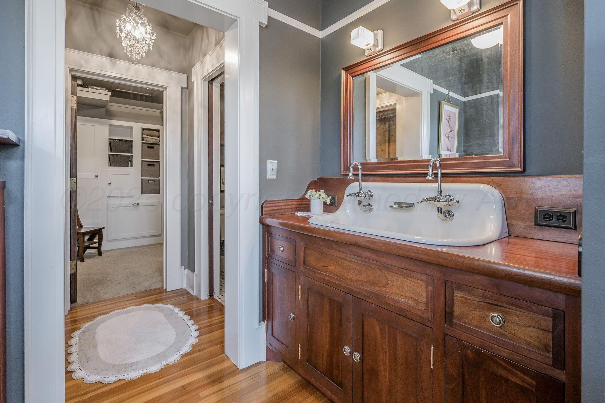 1620 South Tyler Street Amarillo, TX 79102 - Photo 35 of 66 a en suite bathroom with a sink double vanity and a mirror