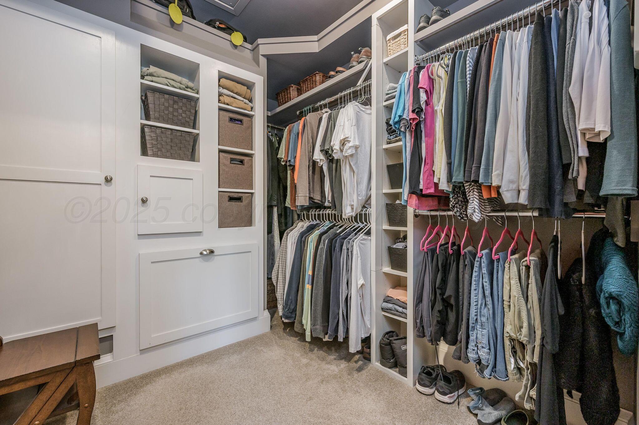 1620 South Tyler Street Amarillo, TX 79102 - Photo 36 of 66 a view of walk in closet with clothes